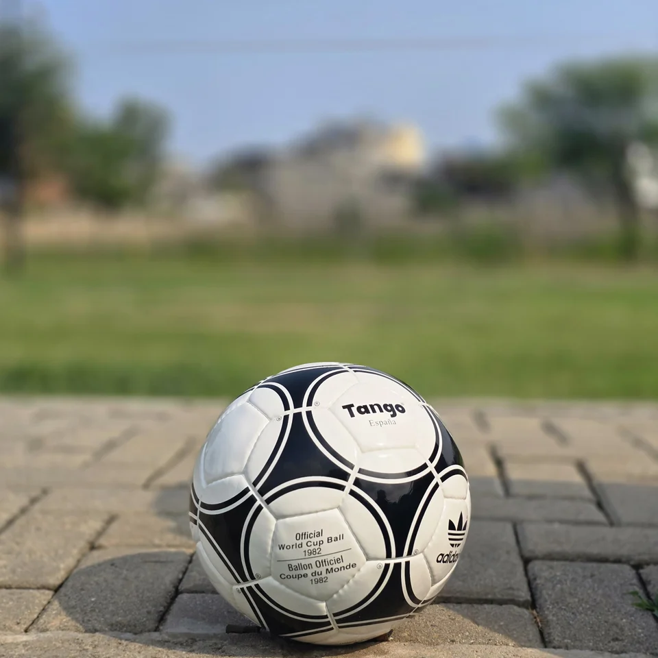 Black Circular Panel Hand-Stitched Football alternate front angle - white handmade football with black circular panel graphics and small printed details