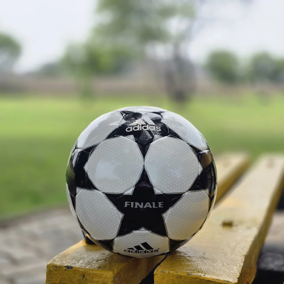 Black Finale-Style Star Hand-Stitched Football front view - black and white handmade football with finale-style star panel graphics