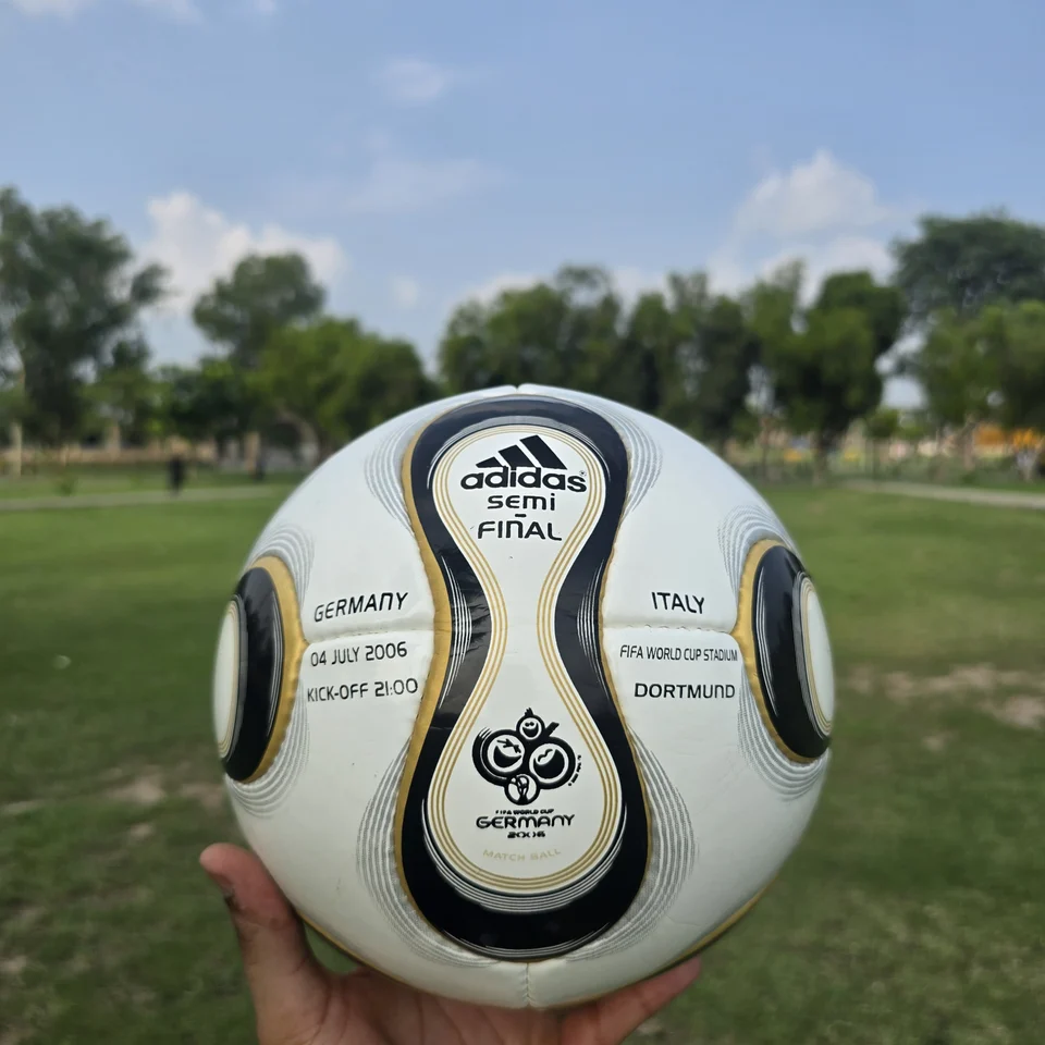 Black Gold Wave Hand-Stitched Football alternate front angle - white handmade football with black and gold wave-shaped panel graphics