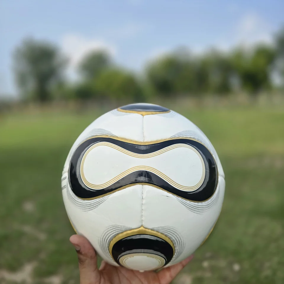 Black Gold Wave Hand-Stitched Football back view - white handmade football with black and gold wave-shaped panel graphics