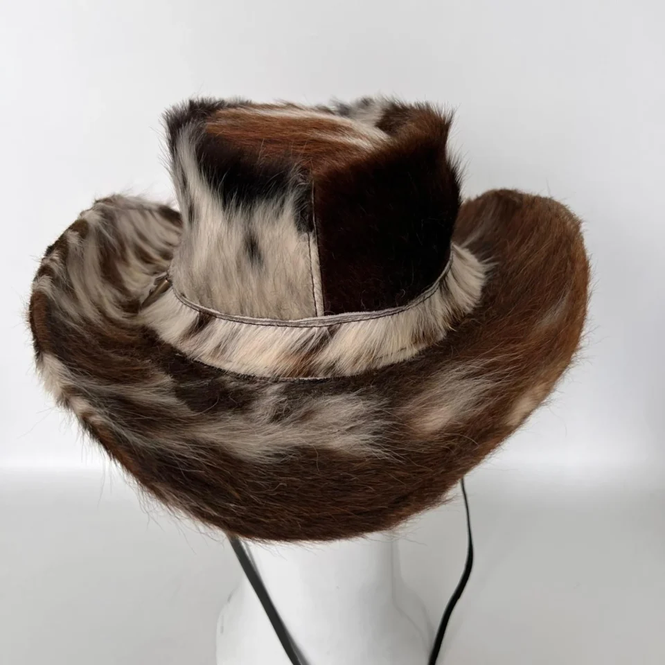 Patchwork Cowhide Western Top Hat side view - brown white and black cowhide pattern western top hat / cowhide hat