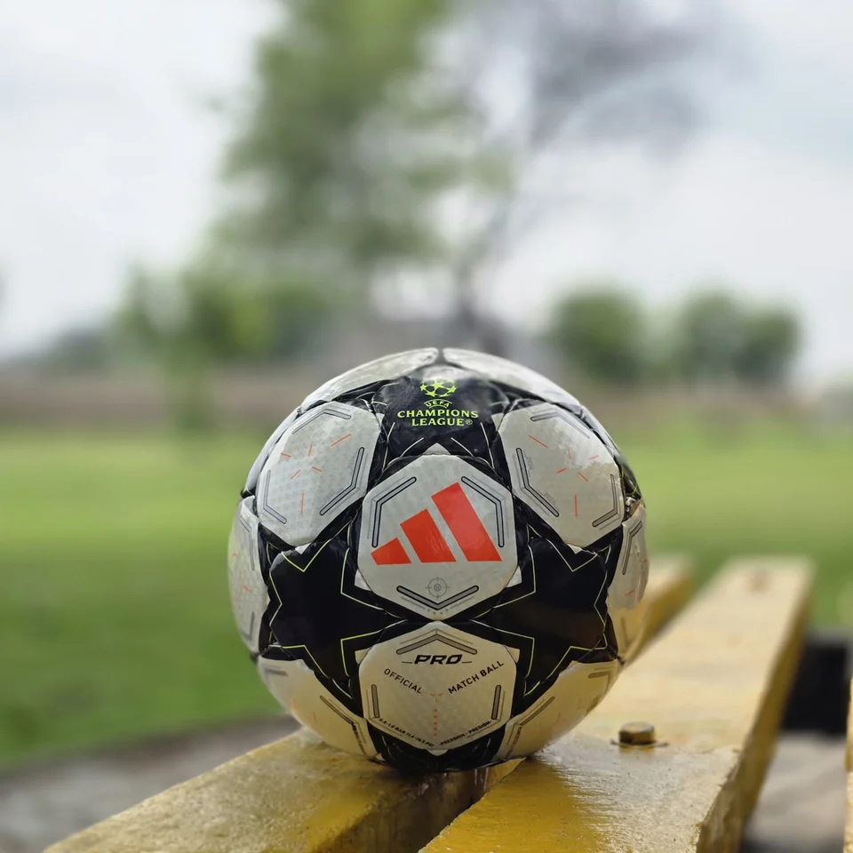 Black Star Graphic Hand-Stitched Football back view - black and white handmade football with star-shaped panels and a small green centre detail