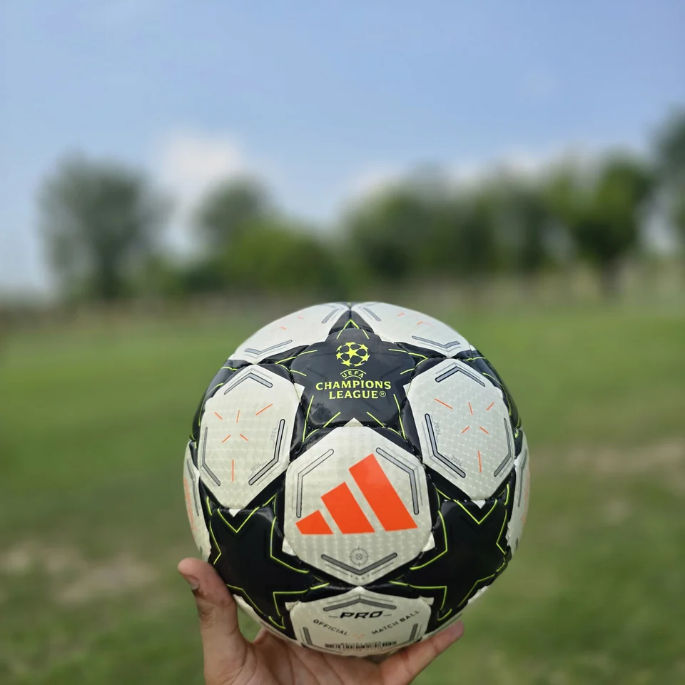 Black White Green Star Hand-Stitched Football back view - black and white handmade football with star panels and a green centre graphic