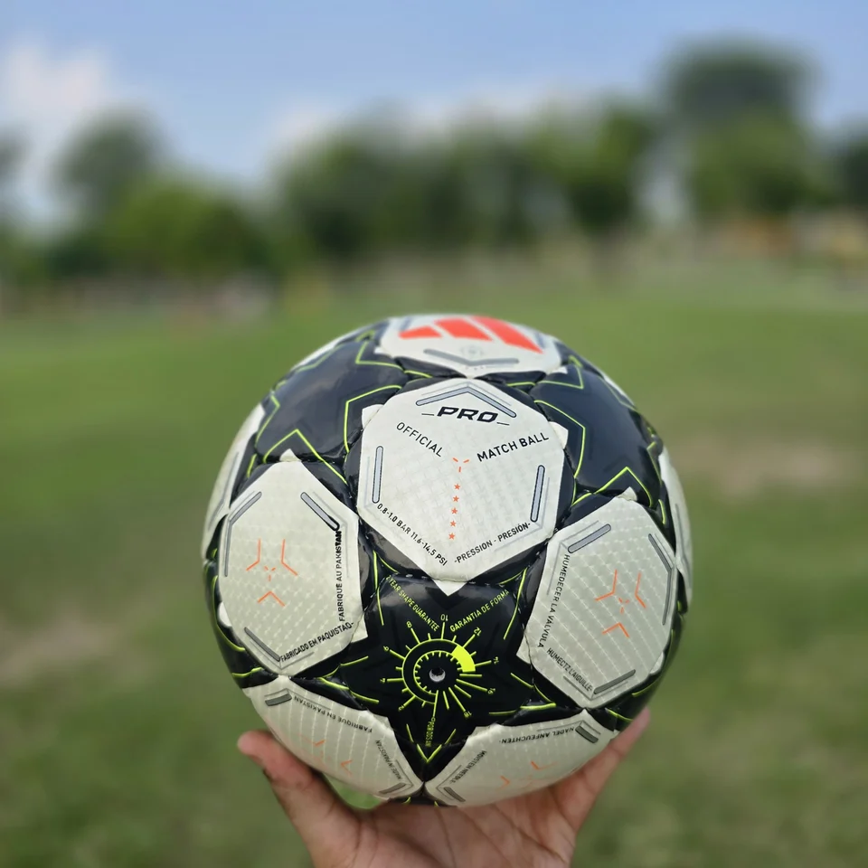 Black White Green Star Hand-Stitched Football front view - black and white handmade football with star panels and a green centre graphic