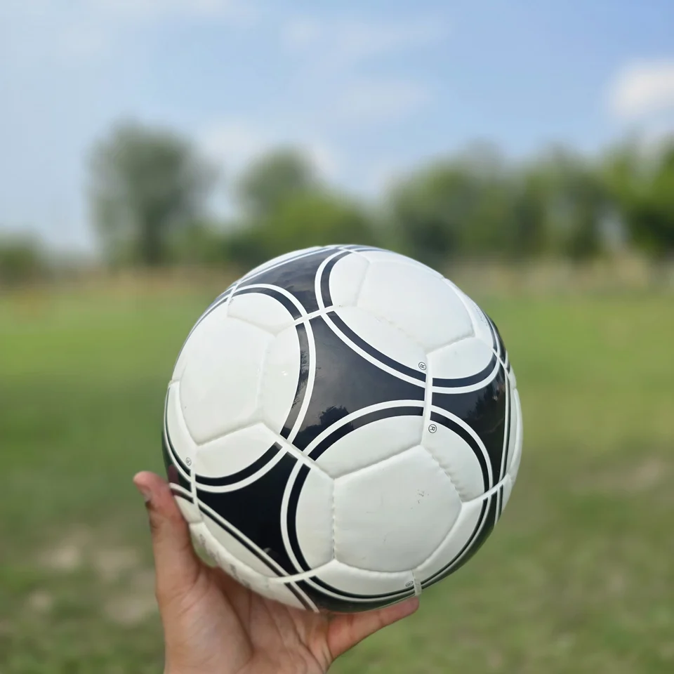 Black White Star Panel Hand-Stitched Football design detail - black and white handmade football with bold star-panel graphics