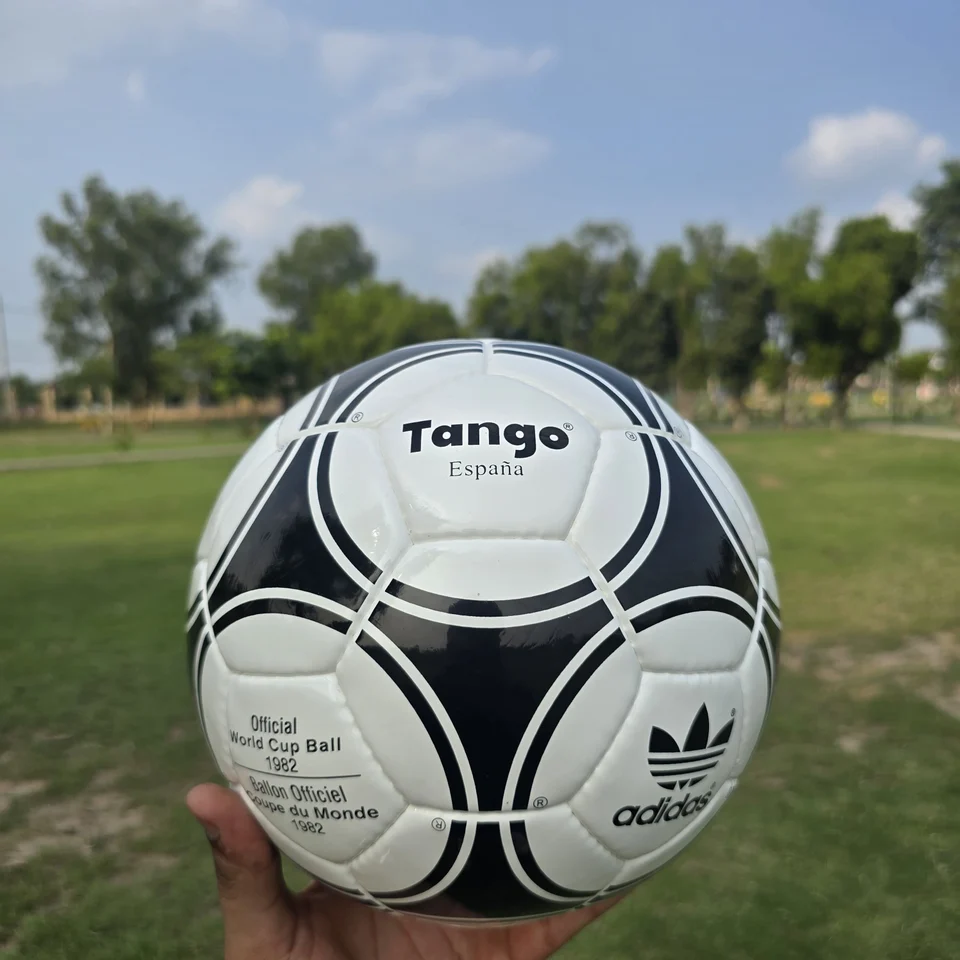Black White Star Panel Hand-Stitched Football front view - black and white handmade football with bold star-panel graphics