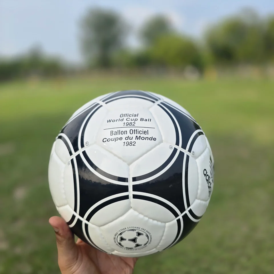 Black White Star Panel Hand-Stitched Football side view - black and white handmade football with bold star-panel graphics