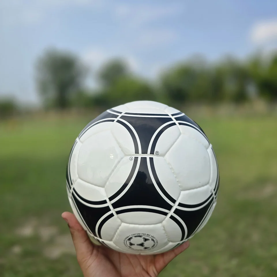 Black White Star Panel Hand-Stitched Football side view - black and white handmade football with bold star-panel graphics