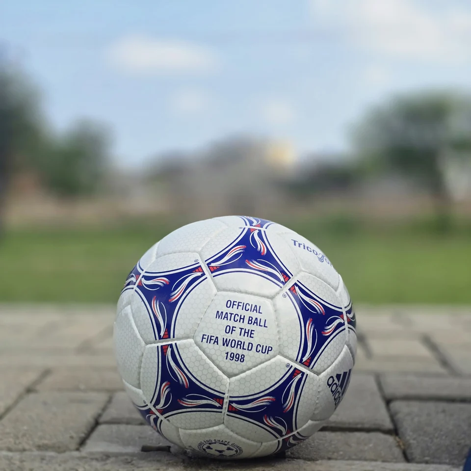 Blue & Purple Panel Hand-Stitched Football alternate front angle - white handmade football with blue and purple flowing panel graphics