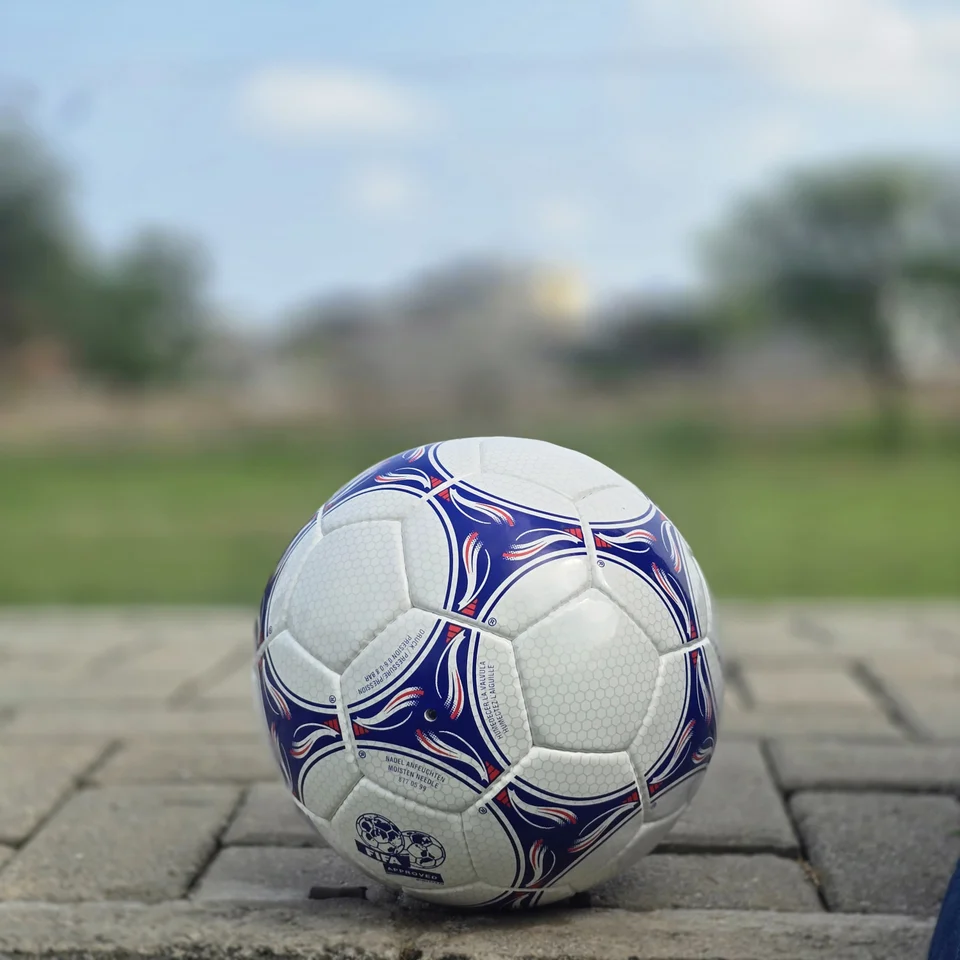 Blue & Purple Panel Hand-Stitched Football back view - white handmade football with blue and purple flowing panel graphics