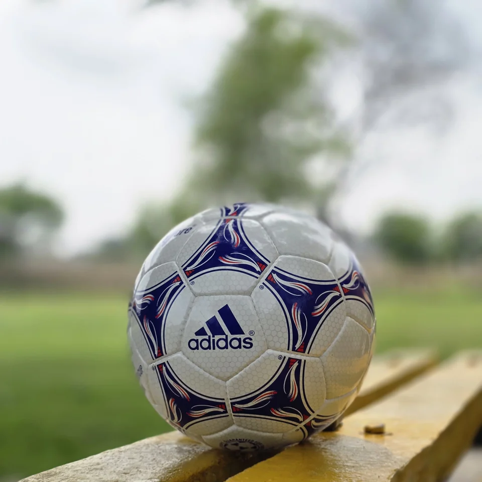 Blue Purple Training Hand-Stitched Football side view - white handmade football with blue and purple stitched graphic panels
