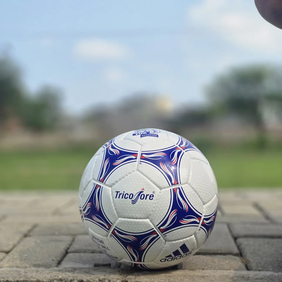 Blue Purple Tricolor-Style Hand-Stitched Football alternate front angle - white handmade football with blue and purple panel graphics and visible tricolor-style printed text