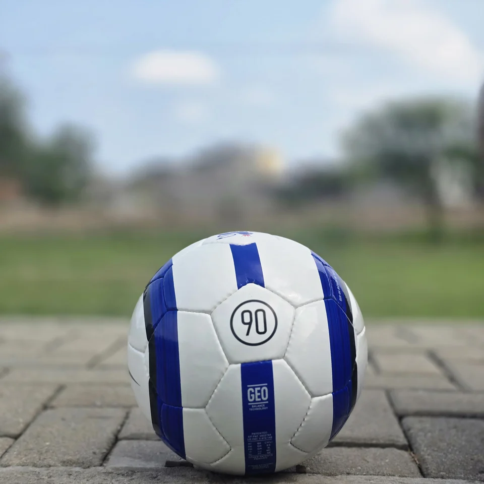 Blue Purple Tricolor-Style Hand-Stitched Football back view - white handmade football with blue and purple panel graphics and visible tricolor-style printed text