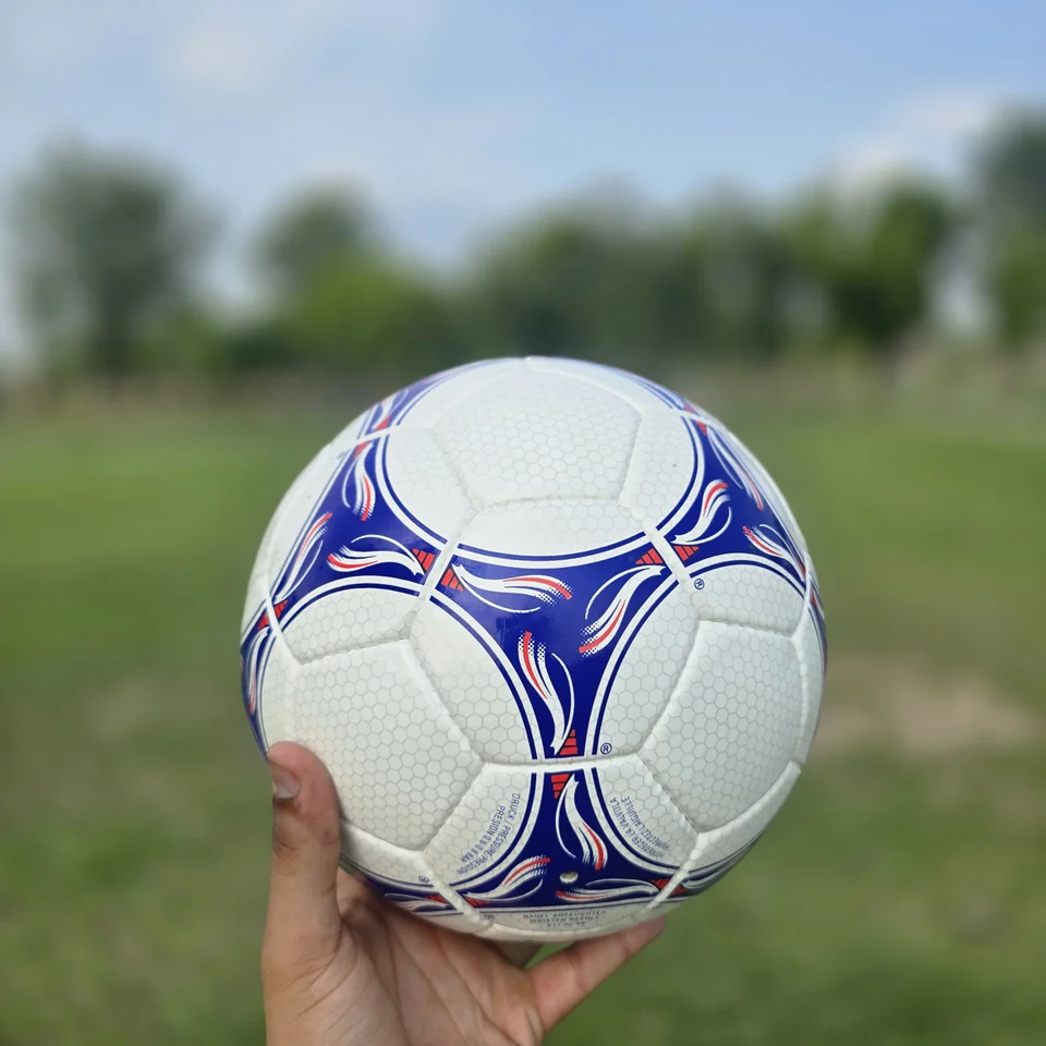 Blue Purple Wave Hand-Stitched Football back view - white handmade football with blue and purple wave-like stitched panel graphics