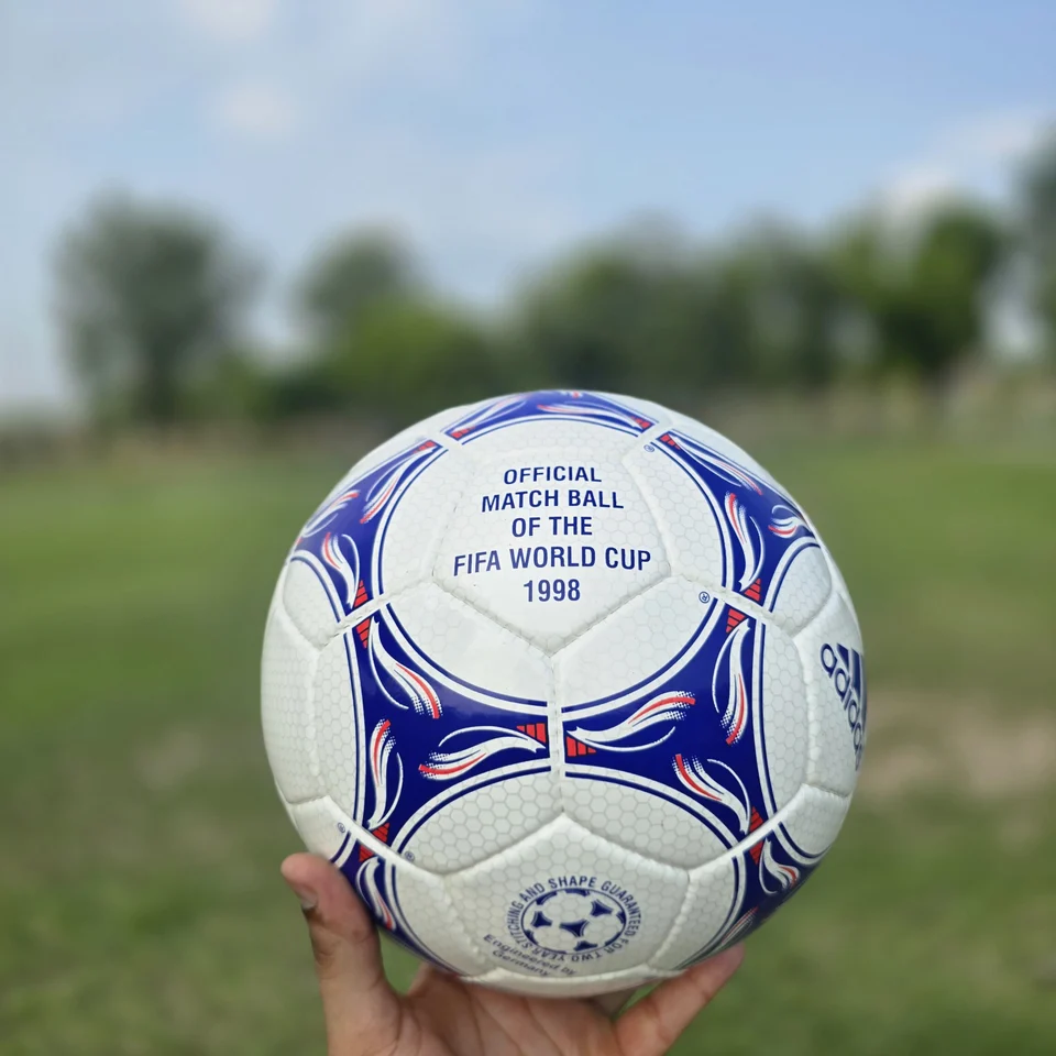 Blue Purple Wave Hand-Stitched Football design detail - white handmade football with blue and purple wave-like stitched panel graphics