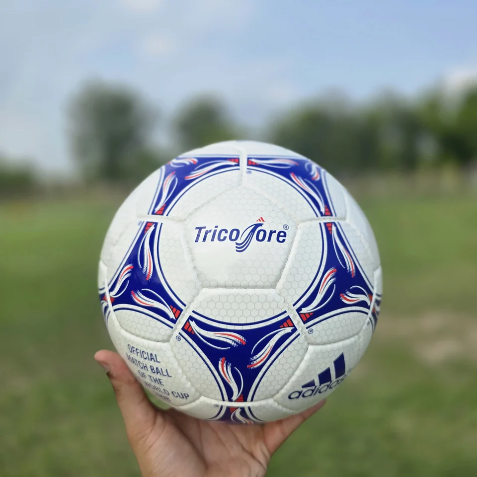 Blue Purple Wave Hand-Stitched Football front view - white handmade football with blue and purple wave-like stitched panel graphics
