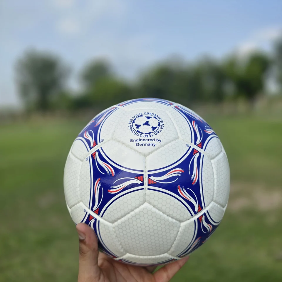Blue Purple Wave Hand-Stitched Football side view - white handmade football with blue and purple wave-like stitched panel graphics