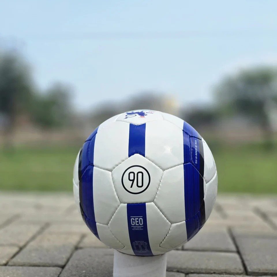 Blue Stripe Custom Panel Hand-Stitched Football side view - white handmade football with blue vertical stripes and a small printed badge detail