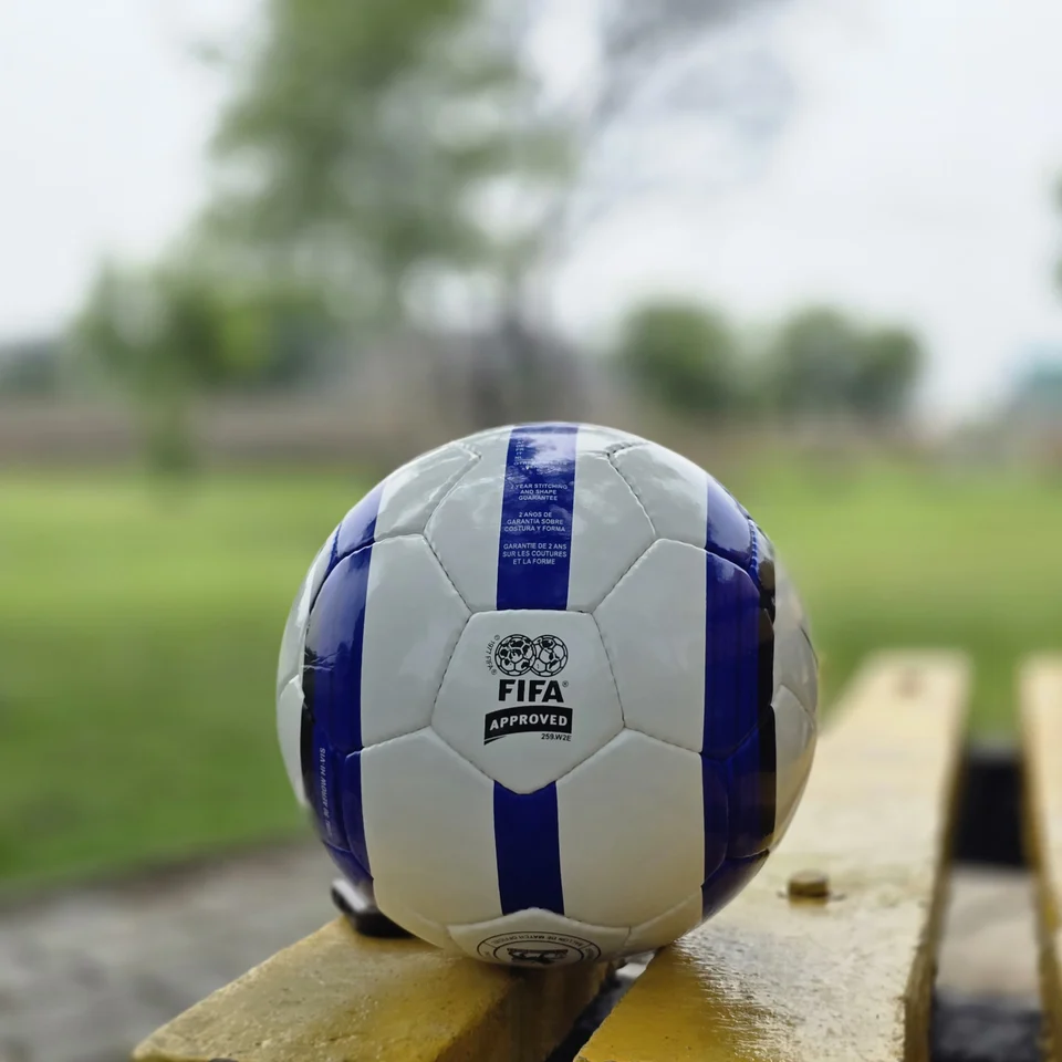 Blue Vertical Stripe Hand-Stitched Football front view - white handmade football with blue vertical stripes and printed quality-style panel mark