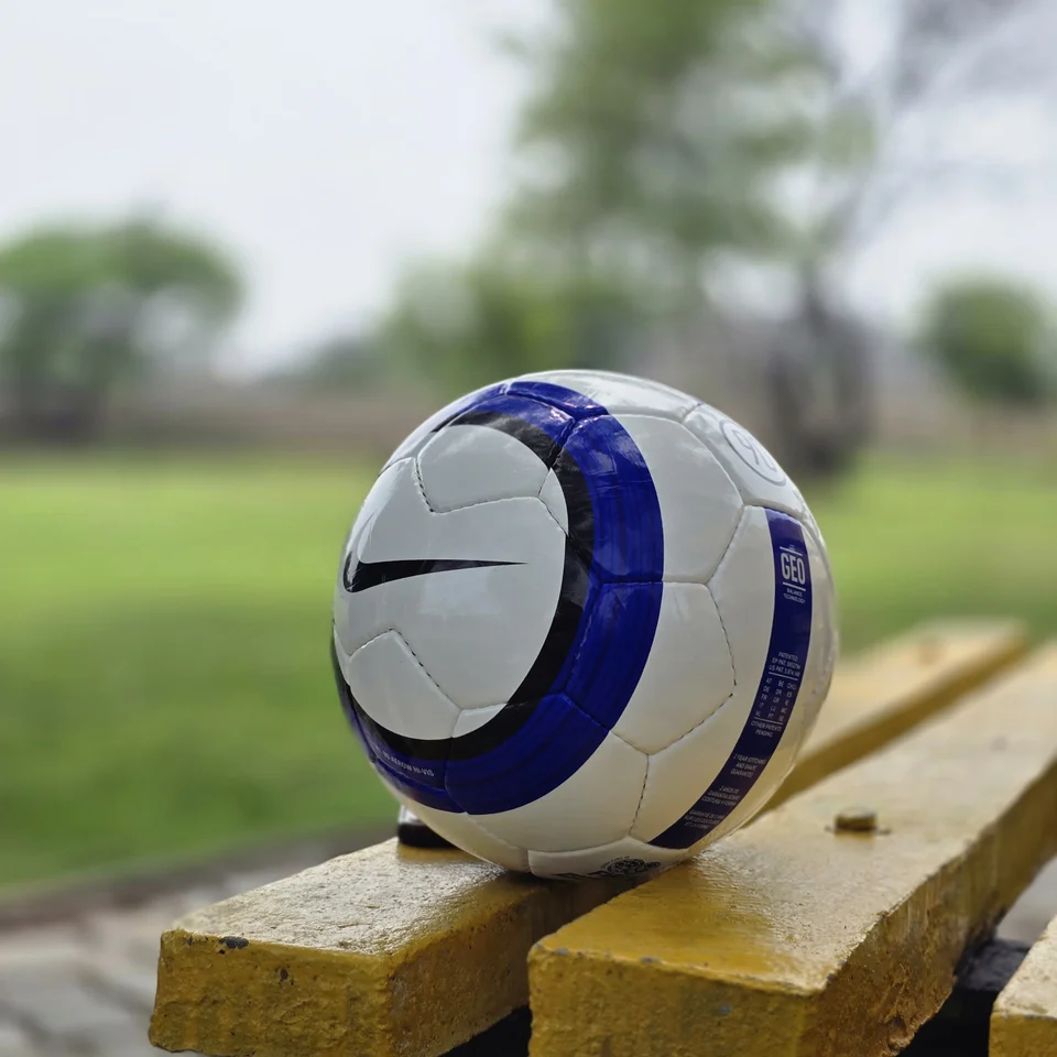 Blue Vertical Stripe Hand-Stitched Football side view - white handmade football with blue vertical stripes and printed quality-style panel mark