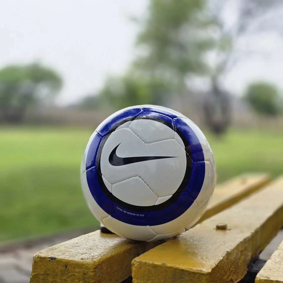 Blue Vertical Stripe Hand-Stitched Football side view - white handmade football with blue vertical stripes and printed quality-style panel mark