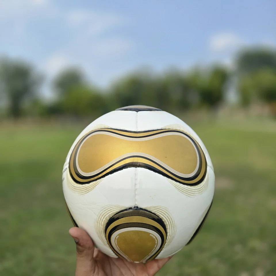 Gold Swirl Hand-Stitched Football back view - white handmade football with gold and black swirl panel artwork