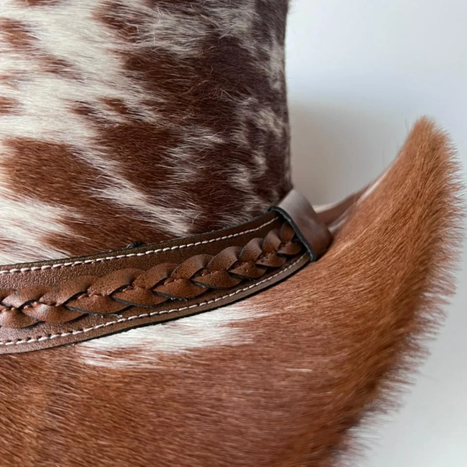 Brown White Cowhide Cowboy Hat with Brown Band side view - brown and white cowhide pattern with brown band cowhide western hat with spotted cowhide-style crown