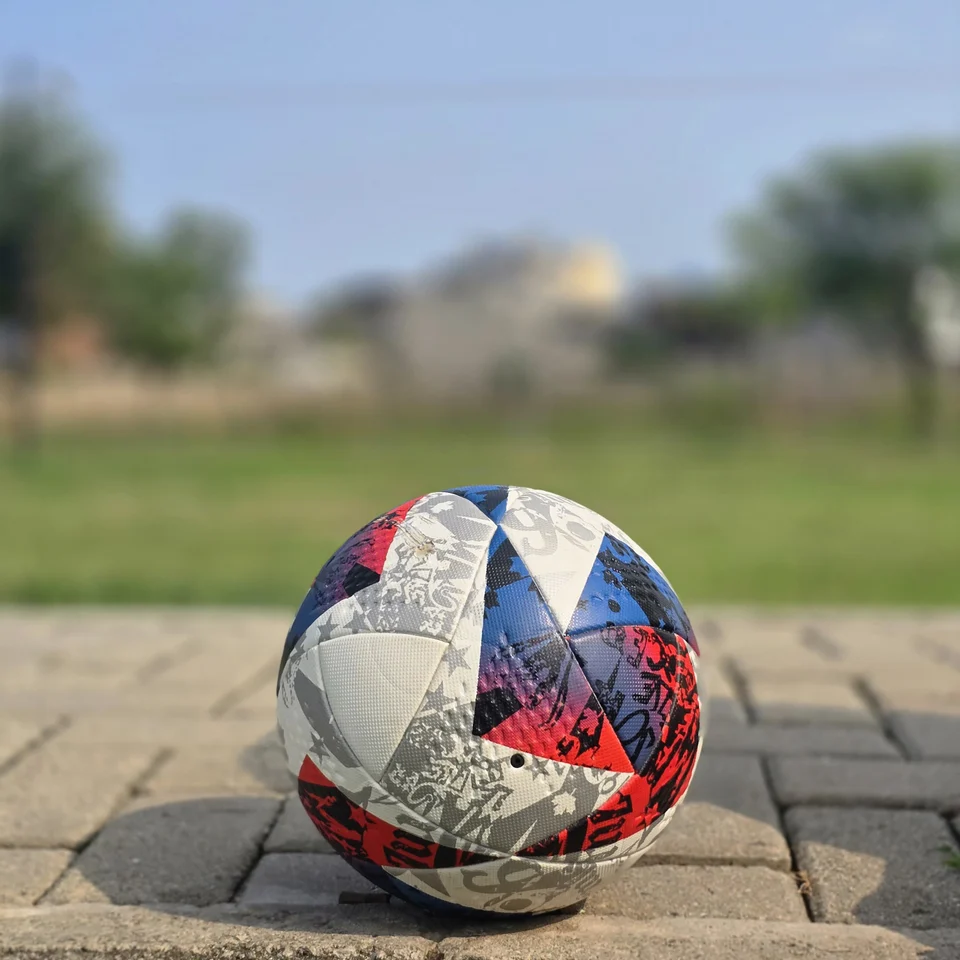 Red Blue & Silver Graphic Hand-Stitched Football front view - handmade football with red, blue, silver, and white angular graphic panels