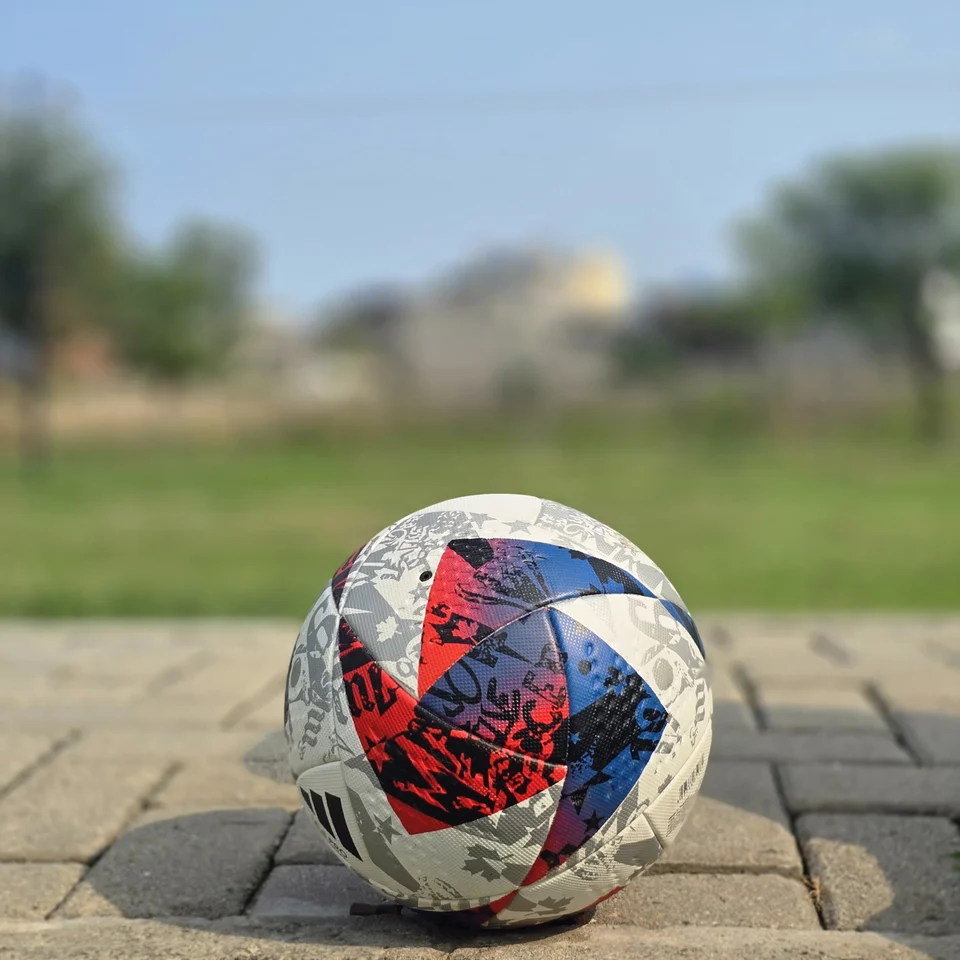 Red Blue & Silver Graphic Hand-Stitched Football side view - handmade football with red, blue, silver, and white angular graphic panels