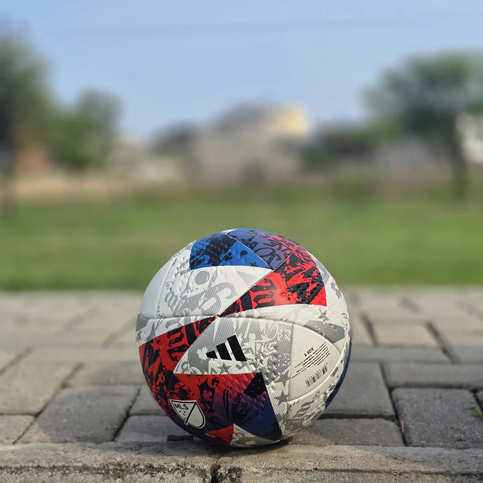 Red Blue & Silver Graphic Hand-Stitched Football side view - handmade football with red, blue, silver, and white angular graphic panels