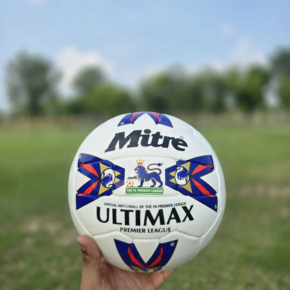 Red Blue Arrow Graphic Hand-Stitched Football back view - white handmade football with red and blue arrow-shaped graphic panels