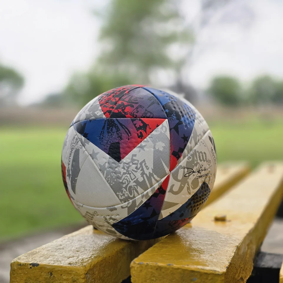 Red Blue Silver Graphic Thermal Bonded Football alternate front angle - thermal bonded football with red, blue, silver, and white graphic panels