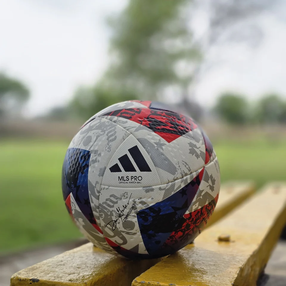 Red Blue Silver Graphic Thermal Bonded Football front view - thermal bonded football with red, blue, silver, and white graphic panels