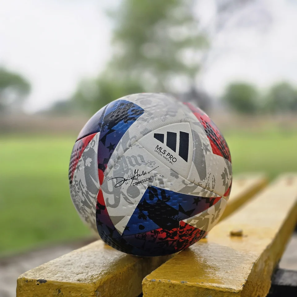 Red Blue Silver Graphic Thermal Bonded Football side view - thermal bonded football with red, blue, silver, and white graphic panels