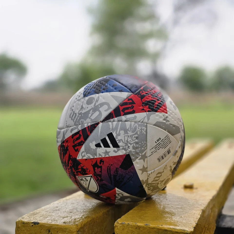 Red Blue Silver Graphic Thermal Bonded Football side view - thermal bonded football with red, blue, silver, and white graphic panels