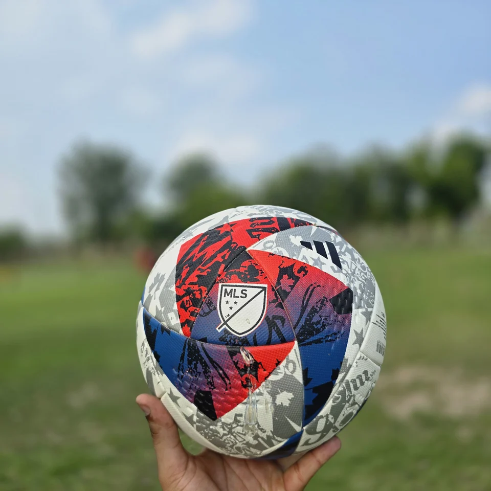 Red Blue Silver M.S Pro Style Thermal Bonded Football side view - thermal bonded football with red, blue, silver, and white angular graphics and visible M