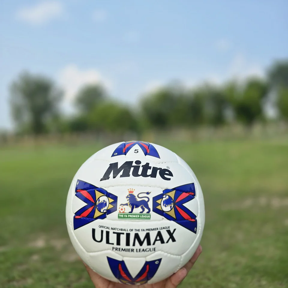 Red Blue Tournament-Style Hand-Stitched Football design detail - white handmade football with red and blue printed panel artwork and match-ball styling