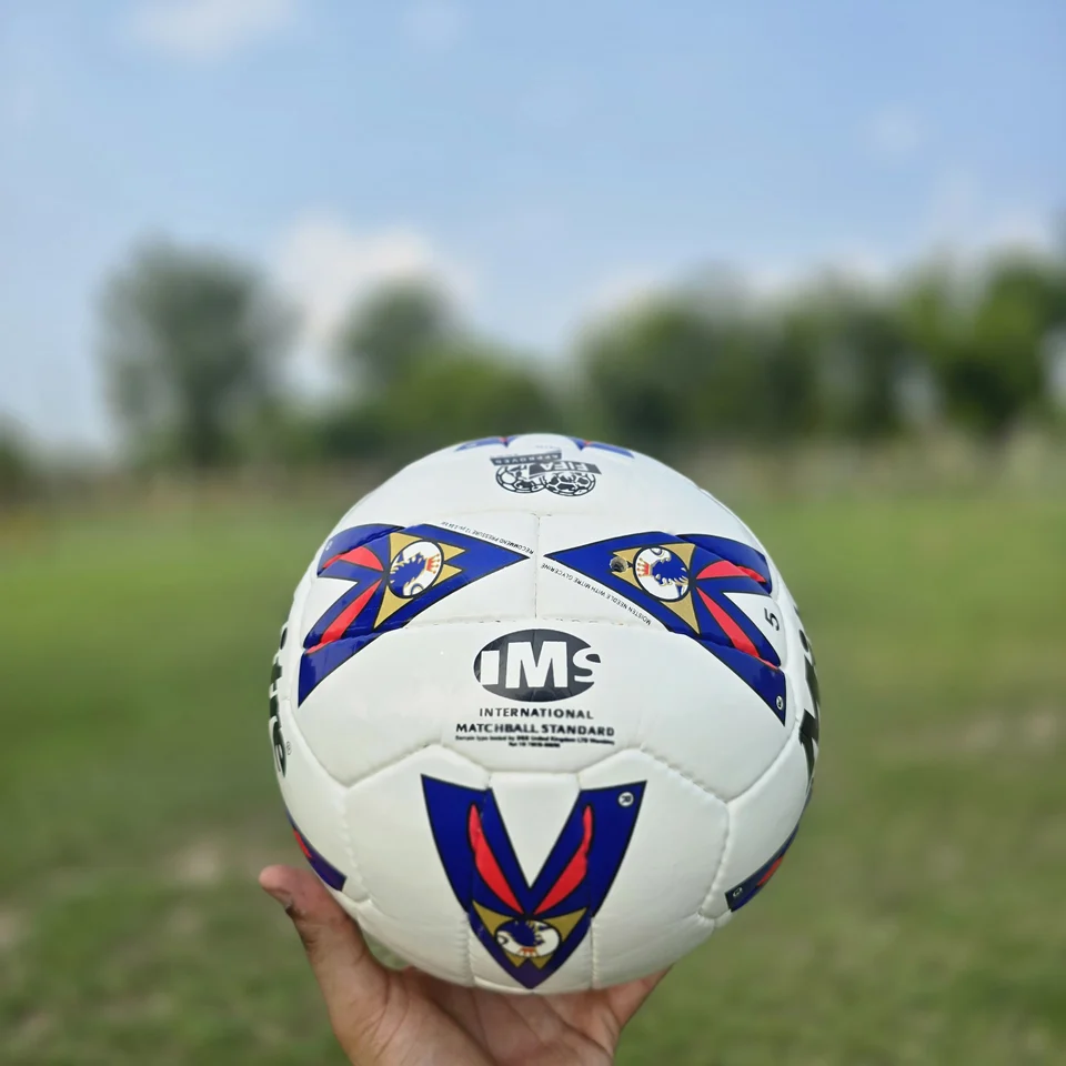 Red Blue Tournament-Style Hand-Stitched Football side view - white handmade football with red and blue printed panel artwork and match-ball styling