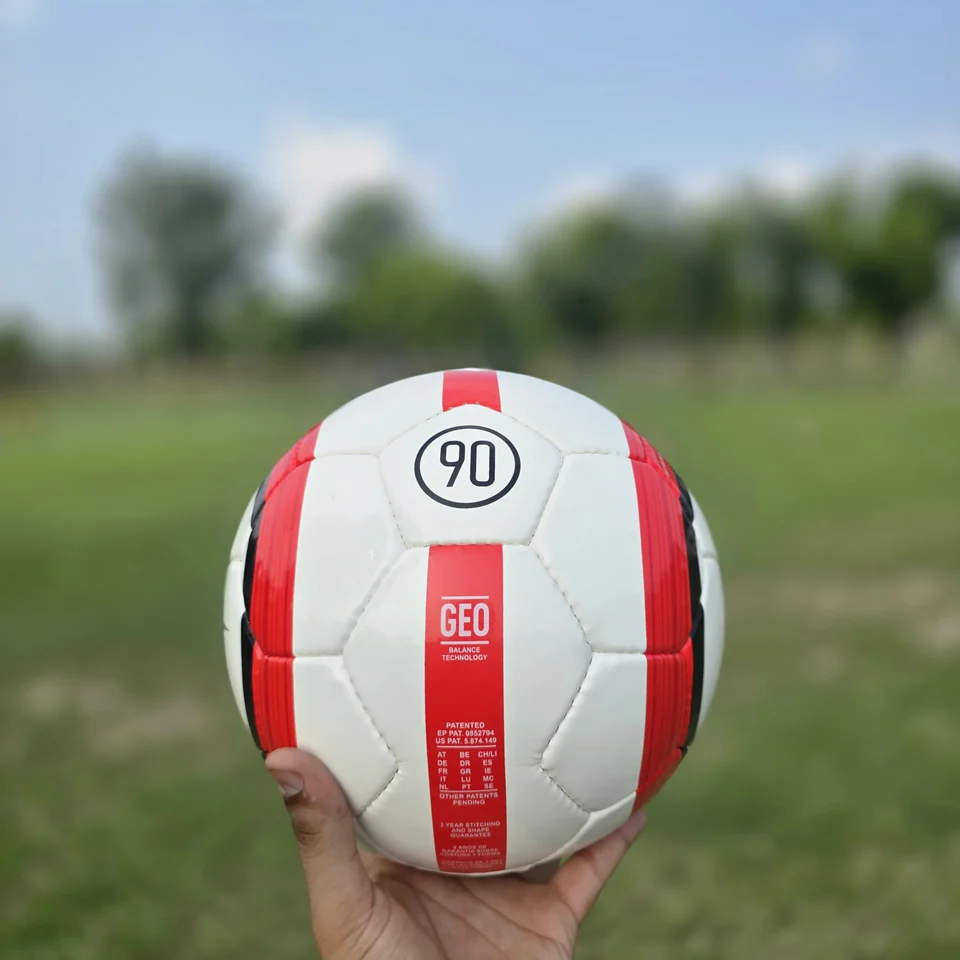 Red Vertical Stripe Hand-Stitched Football front view - white handmade football with red vertical stripe panels and printed badge detail
