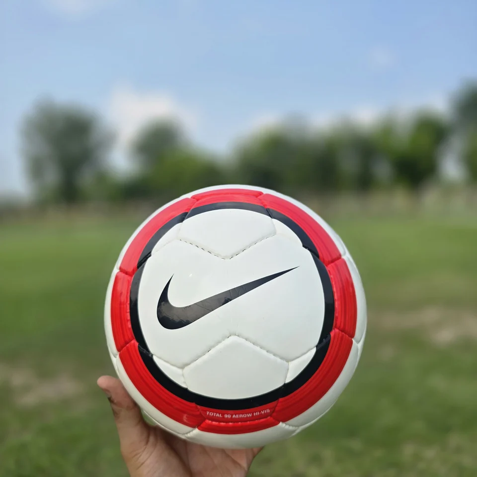 Red Vertical Stripe Hand-Stitched Football side view - white handmade football with red vertical stripe panels and printed badge detail