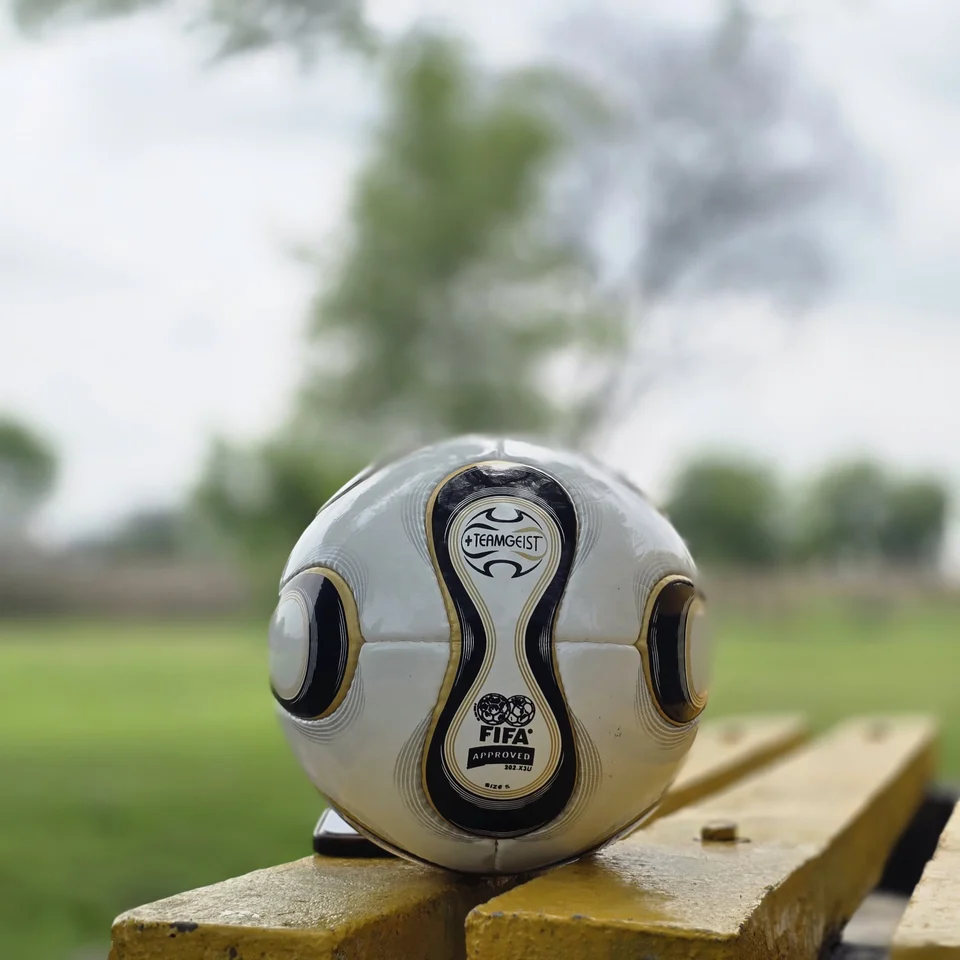 White Black Gold Swirl Hand-Stitched Football alternate front angle - white handmade football with black and gold swirl panel artwork