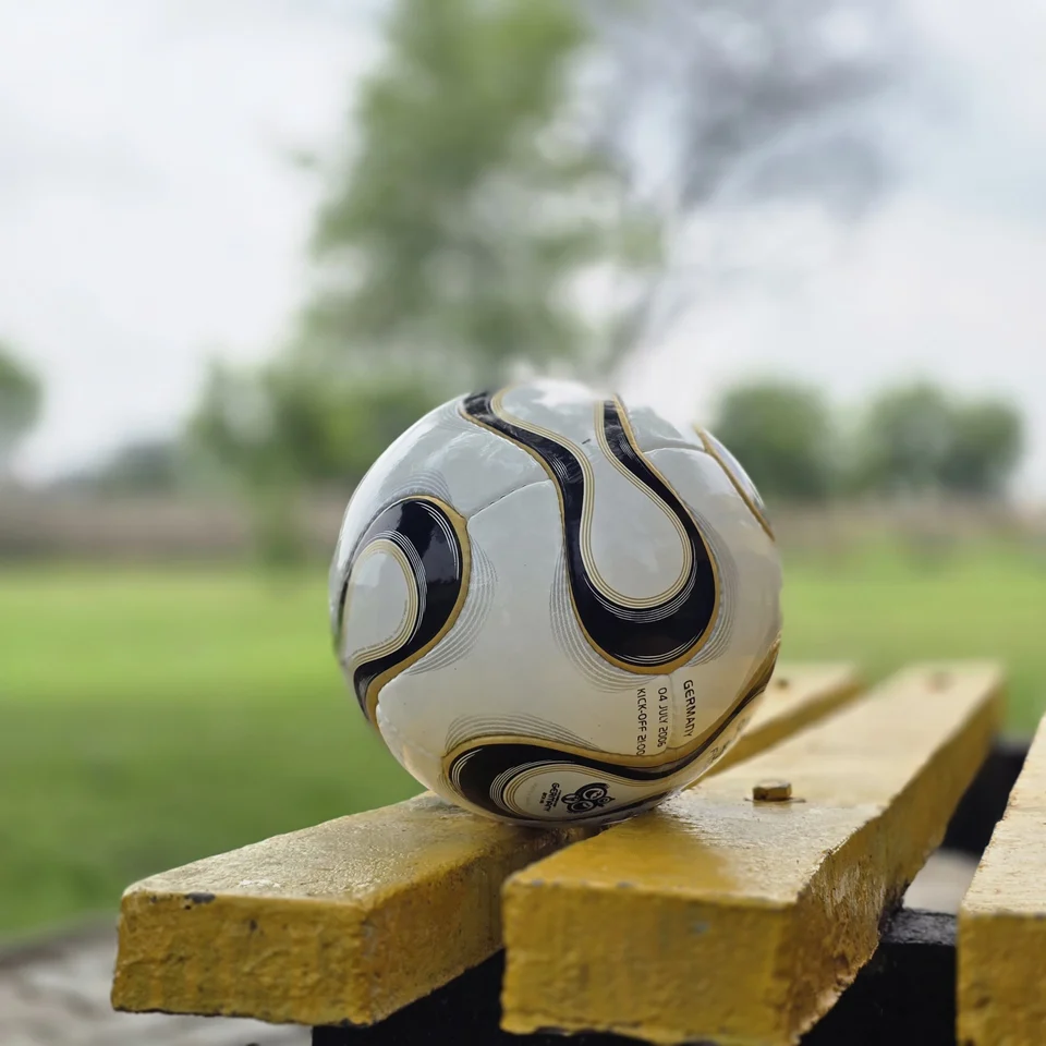 White Black Gold Swirl Hand-Stitched Football back view - white handmade football with black and gold swirl panel artwork