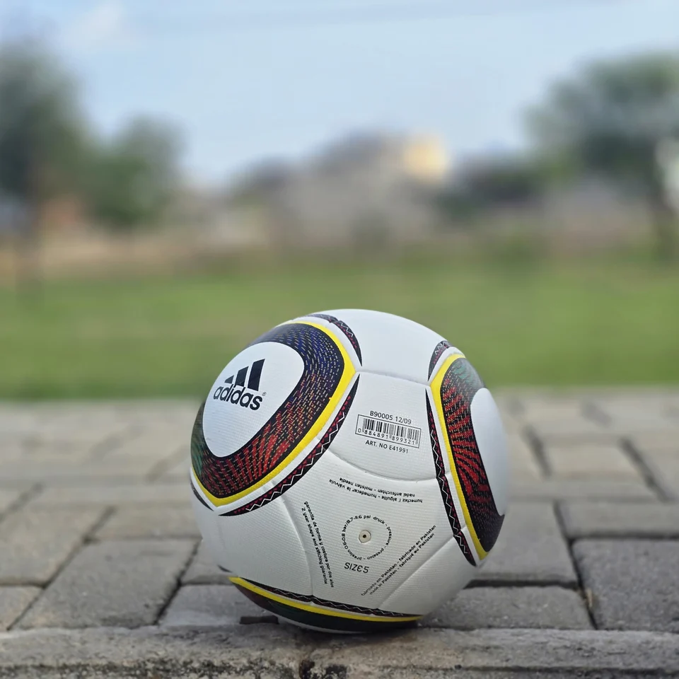 White Black Yellow Ring Thermal Bonded Football alternate front angle - white thermal bonded football with black and yellow circular ring panel graphics