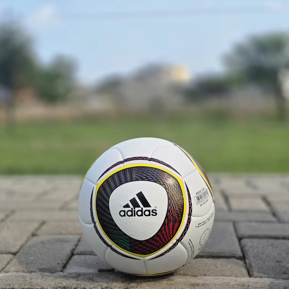 White Black Yellow Ring Thermal Bonded Football back view - white thermal bonded football with black and yellow circular ring panel graphics