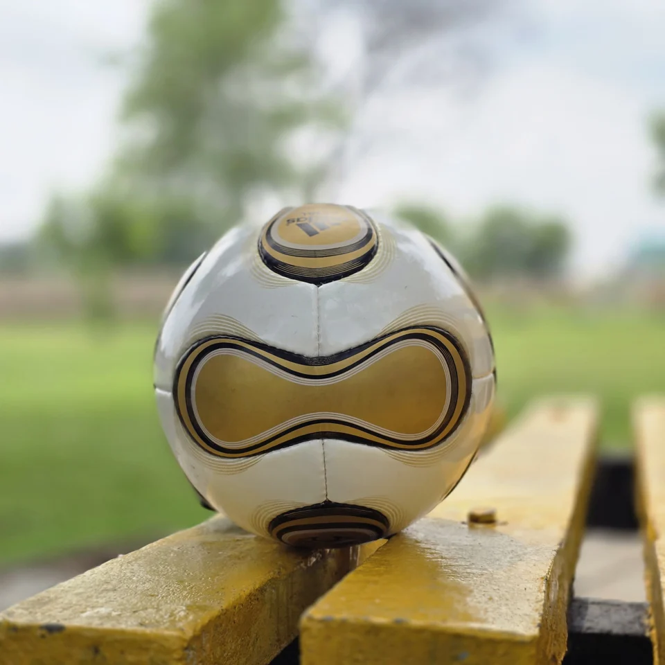 White Gold Wave Hand-Stitched Football back view - white handmade football with gold wave graphics and black trim