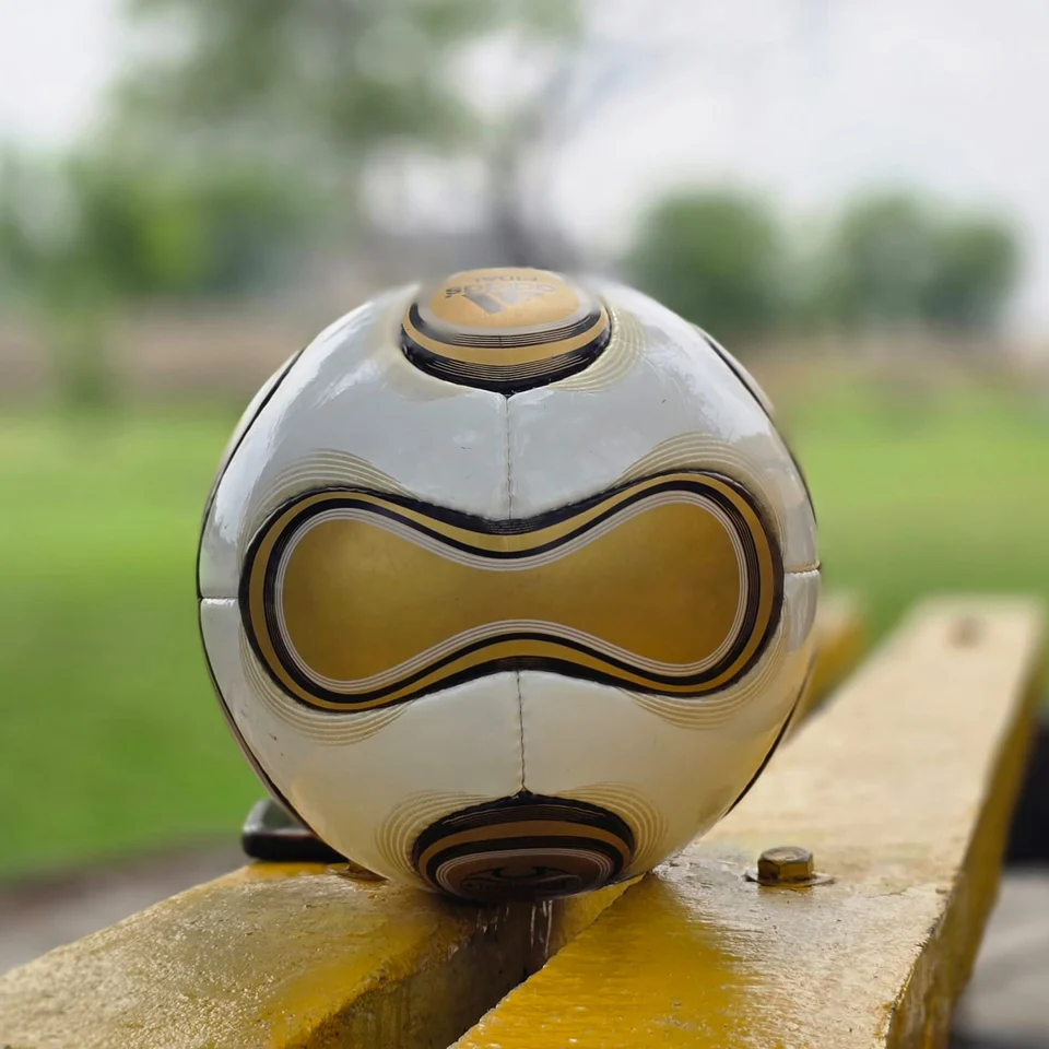 White Gold Wave Hand-Stitched Football design detail - white handmade football with gold wave graphics and black trim