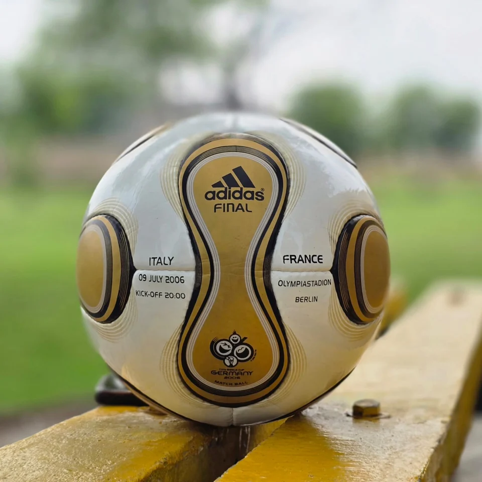 White Gold Wave Hand-Stitched Football front view - white handmade football with gold wave graphics and black trim
