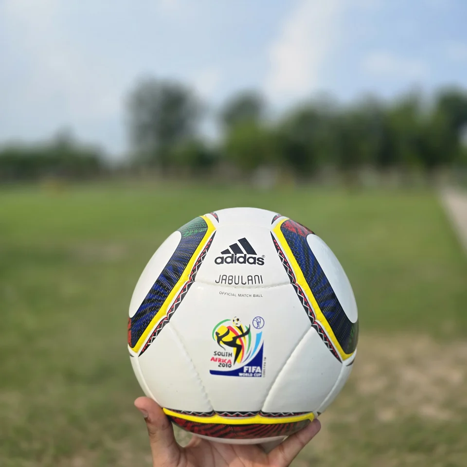 White Green Yellow Panel Hand-Stitched Football alternate front angle - white handmade football with green, yellow, and black panel accents
