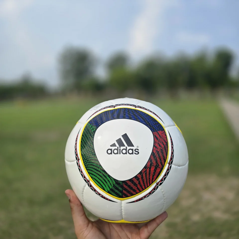 White Green Yellow Panel Hand-Stitched Football back view - white handmade football with green, yellow, and black panel accents