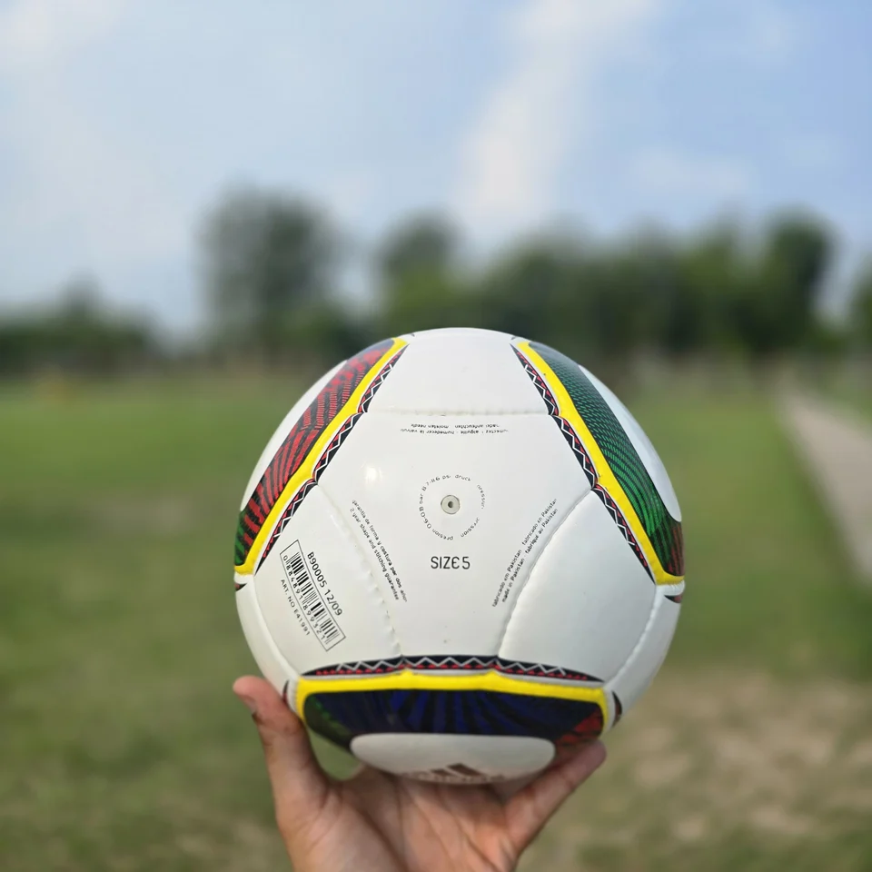 White Green Yellow Panel Hand-Stitched Football side view - white handmade football with green, yellow, and black panel accents